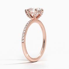 a rose gold engagement ring with an oval cut diamond