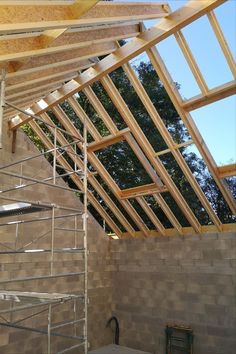 an unfinished room with scaffolding on the ceiling