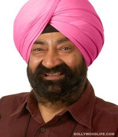 a man with a pink turban on his head