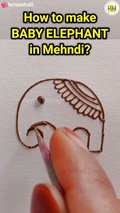 someone is drawing an elephant on paper with the words how to make baby elephant in mehndi?