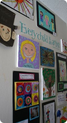 there are many children's artwork on the wall