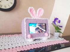 a crocheted photo frame with an easter bunny on it