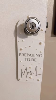 a white door with a sign that says preparing to be mrs l