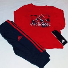 Brand New Never Worn With Tags. Adidas Set Includes A Red Long Sleeve Cotton Blend Tee Top With Classic Adidas Inscription On Front In White And Black Trim Blend. Bottoms Are Black Cotton Blend Design With Elastic Waistline And Classic Adidas 3 Pale Logo And Inscription On Left Leg With Banded Leg Opening And 3 Red Stripes Down Each Outer Leg. Set Fits 3 Months Boys Infant. Any Questions, Please Contact Me. Thanks! Red Long Sleeve Sports Sets, Sporty Red Long Sleeve Set, Red Sports Sets For Winter, Red Winter Sports Sets, Adidas Cotton Sets For Winter, Adidas Cotton Winter Sets, Red Cotton Sports Set, Sporty Red Playwear Set, Red Sporty Playwear Sets