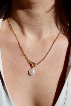 "PRODUCT DETAILS: *Length: 18\" *Chain: Rolo Chain *Clasp: Front Sailors Clasp *Stone/Crystal: Fresh Water Pearl *Gold: 14k Gold Filled *Tarnish-resistant, waterproof, and safe for sensitive skin All our jewelry is made from gold-filled materials that won't tarnish or turn your skin green. From the beginning of launching MWW DESIGNS, we wanted to create high-quality and affordable jewelry for our customers. Using materials such as gold-filled allows us to bring beautiful jewelry to you that is tarnish-resistant, waterproof, and safe for sensitive skin. EDUCATION: Gold-filled jewelry is created through a heating process by bounding a thick layer of gold onto a base metal, usually brass or copper. Gold-filled contains 5% of solid gold, compared to 0.5% for gold-plated jewelry, which makes th Front Clasp Necklace, Skin Education, 2023 Accessories, Jewelry Stack, Jewelry Clasps, Stacked Jewelry, Pretty Clothes, Fresh Water Pearl, Stone Crystal