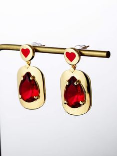 These enamel heart earrings with glass stone will add a simplistic yet classy touch to any style. Handmade in a classic shape, it is elegant whether dressed up or down. by skilled artisans in India, each piece radiates craftswomanship and effortlessly cool style. DETAILS Approx. 1.2"H x .58"W 18K Gold-plated brass Glass stone Hard enamel Steel posts 100% lead & nickel free Imported Photo: Aggy-wide-GRjA0oZDosE-Unsplash Elegant Enamel Heart Cut Jewelry, Elegant Heart Cut Enamel Jewelry, Elegant Metal Earrings With Heart Charm, Gold Heart-shaped Enamel Earrings, Gold Enamel Heart-shaped Earrings, Gold Enamel Heart Earrings, Gold Enamel Earrings For Valentine's Day, Elegant Heart-shaped Enamel Earrings, Elegant Enamel Heart Pendant Jewelry