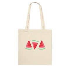 a watermelon tote bag with two pieces of watermelon on it