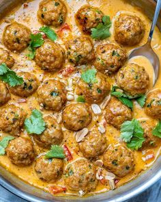 turkey meatballs in curry sauce with cilantro and parsley garnish