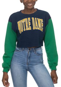 Make your way to the big game in this Notre Dame Fighting IrishWomens White Crop Colorblock Sleeve Crew Sweatshirt! This Fighting Irish Long Sleeve Sweatshirt features a screen print team name on center chest. Stay warm and comfortable with this Womens Fighting Irish Fighting Irish Crew Sweatshirt. College Blue Color Block Sweatshirt, Sporty Fall Tops With Color Block, Sporty Color Block Winter Tops, Sporty Color Block Tops For Winter, Sporty Color Block Top For Fall, Green Winter Tops With Contrast Color, Sporty Contrast Color Tops For Fall, Winter Green Tops With Contrast Color, Trendy Green Top With Contrast Color