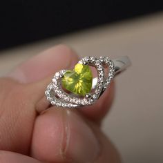 This is a gorgeous handmade creation. Its beauty is its simplicity & Elegance. The 6*6 mm heart cut faceted natural Peridot is crafted in solid sterling silver and with rhodium plated. All item is sent in a beautiful gift box If you have any idea of design your ring,pls contact me directly. You can realize more lovely stuff clicking the link https://www.etsy.com/shop/knightjewelry?refshopsection_shophome_leftnav Please leave the correct address and you phone number for delivering successfull Wedding Rings Heart, Heart Cut Ring, Rings Heart, Cut Rings, Heart Wedding Rings, August Birthstone Ring, Future Engagement Rings, Peridot Jewelry, Rings Unique