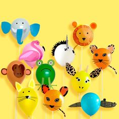 a bunch of balloons that have animals on them