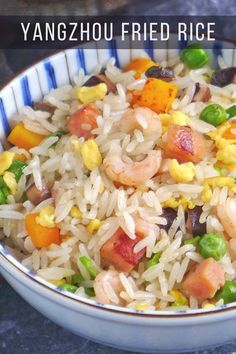 a bowl filled with rice and vegetables on top of a table