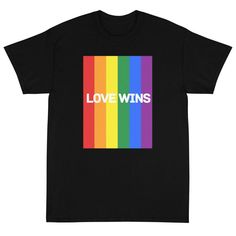 Spread the love and show your support for the LGBTQ+ community with our "Love Wins" short sleeve t-shirt. This stylish and comfortable tee is perfect for anyone looking to express their pride and allyship. More Details Show your support for the LGBT community with this stylish and comfortable "Love Wins" t-shirt. Made with high-quality materials, this t-shirt is durable and will last for many wears to come. Spread awareness and positivity with the rainbow colors and inspiring message on this t-s Comfortable Love, Love Wins, Pride Shirts, Inspirational Message, The Rainbow, Our Love, Rainbow Colors, Size Chart, Rainbow