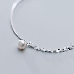 Length: 8.25 + 1.25 inchesThese cute dainty girl anklet features a simple baroque pearl drop on contrast chain with half snake chain and half twisted chain, made of 925 sterling silver. Light and comfortable to wear, this pearl drop anklet will add an accent to your complete summer look. Shipping Policy: Order will be shipped within 1-3 business days. First class mail will take 7-14 days to arrive for U.S. orders. International shipping time is vary per shipping method. Contact us to get more de Elegant Sterling Silver Snake Chain Bracelet, Elegant White Silver Chain Bracelet, Minimalist Silver Pearl Bracelet With Adjustable Chain, Elegant Pearl Anklets With Pearl Chain, Elegant Silver Anklets With Pearl Chain, Elegant Sterling Silver Anklets With Adjustable Chain, Elegant White Anklets With Pearl Chain, Elegant Pearl Chain Anklets, Elegant Silver Chain Anklets