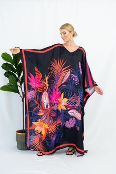 A full length kaftan plus size featured with abstract floral vibrant print  will bring the elegant vibe of forever spring and would be a perfection for holiday occasions or any event you attend. The fabric is blended silk with more than 80% silk so the care is more easier with washing and iron, in addition less wrinkles. It's totally smoothly flowy, soft and gentle touch. FEATURES - Pink, Black and Vibrant Colors - Palm and Leaf - Personal Custom Made - Full Length Kaftan Half-Sleeves - Designer Silk Kaftan - Plus Size and Custom Length - Resort Wear, Beach Wear, Lounge Wear, Pool Cover Up Kaftan - Boat Neck -------------------------------- DETAIL  * The size can be adjusted to fit up to 5 XL. Bust/ Waist/ Hip up to 53 inches ( 106 inches full circumference)  * Length of the kaftan could b Oversized Floral Print Maxi Dress For Beach, Oversized Floral Print Maxi Dress For Vacation, Vibrant Print Kaftan With Kimono Sleeves For Beach, Beachwear Kaftan With Vibrant Print And Kimono Sleeves, Multicolor Print Kaftan With Kimono Sleeves For Vacation, Black Floral Print Maxi Kaftan, Beach Kaftan With Kimono Sleeves And Abstract Print, Multicolor Tropical Kaftan With Kimono Sleeves, Long Floral Print Patterned Kaftan