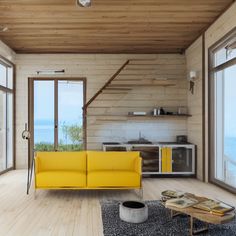 a yellow couch sitting in the middle of a living room next to an open window