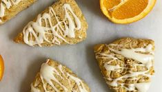 oranges and pastries with icing next to each other