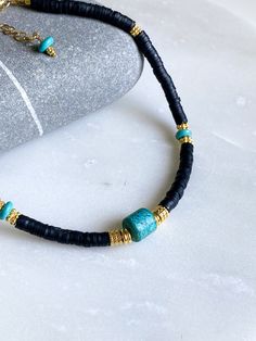 FILIPPA NECKLACE Black Fimo choker necklace with turquoise central stone, turquoise beads, fimo beads and gold plated details Dimensions: Total necklace length  38cm/ 14,9in + 5cm / 1,9in extra extender chain Weight: 22gr DELIVERY (estimate delays) Greece: 2-5 business days via ELTA  Europe: 5-10 business days via Hellenic Post International: 10-21 business days via Hellenic Post You can shorten considerably your delivery times by upgrading to DHL Express services at checkout.  All PURE GREEK Jewels  are inspired from the ancient greek arts, folklore traditions and world cultures. Our jewelry are handmade with love and imagination so you can enjoy unique creations.   I use mineral and semi-precious stones, crystals, real pearls,  gold plated brass metal, wooden elements, greek and oriental Beach Jewelry With Black Heishi Beads, Adjustable Turquoise Heishi Bead Necklaces, Adjustable Bohemian Turquoise Necklace With Heishi Beads, Adjustable Turquoise Heishi Beads Necklace, Adjustable Turquoise Heishi Beaded Necklaces, Handmade Turquoise Heishi Beads Necklace, Handmade Adjustable Black Turquoise Necklace, Bohemian Adjustable Black Turquoise Necklace, Fimo Beads