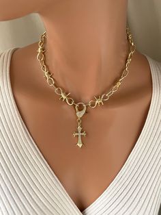 This is a 14k gold filled barbed wire, chain, choker necklace for men or women.  CZ cross pendant measures 34X18mm.  A large pave lobster clasp sits at front with a cross hanging from it. Large barb wire links measure 30x 15 MM.  model is wearing a 16 inch length. Longer lengths available. Comes in a gift box ready to present. Cross Choker Necklace, Barb Wire, Cross Choker, Thick Chain Necklace, Necklace Cross, Gold Cross Necklace, Wire Necklace, Barbed Wire, Necklace Choker