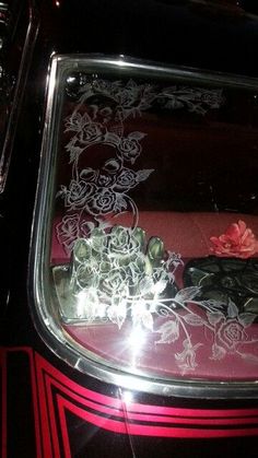 the car is decorated with flowers and lights on it's side window sill