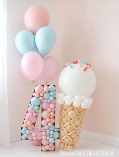 ice cream cone with balloons in the shape of letters