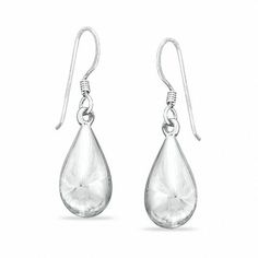 Simple, sweet and shimmering, these teardrop-shaped drop earrings are a great look anytime. Fashioned in sterling silver, each slightly puffed teardrop drop is finished with a polished shine and suspends from a French wire back. Simple Silver Jewelry, Silver Jewellery Online, Ivory Earrings, Fine Silver Jewelry, Jewelry Bracelets Silver, Casting Jewelry, Local Jewelry, Ancient Jewelry, Silver 925 Necklace