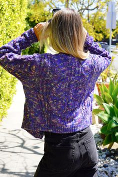 Spread peace and warmth with our cozy acrylic cardigan jacket. With unique contrasting buttons and a peace sign imprint on the back, you'll make a bold statement while staying stylish and comfortable. A must-have for those who don't take themselves too seriously. Fabric: Acrylic Model wears a small Tumble dry on low Purple Relaxed Fit Sweater For Fall, Oversized Long Sleeve Hippie Cardigan, Purple Long Sleeve Cable Knit Cardigan, Long Sleeve Purple Cable Knit Cardigan, Trendy Winter Festival Outerwear, Casual Winter Festival Sweater, Trendy Purple Cotton Cardigan, Hippie Long Sleeve Fall Cardigan, Hippie Long Sleeve Cardigan For Fall