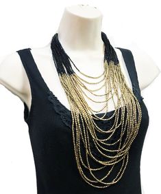 "beautiful long boho Beaded necklace, perfect for the upcoming holiday parties, beach parties etc. ** Long and Layering Necklace ** hand beaded jewelry ** Length of Necklace is 38 inches ** Perfect on a Little Black Dress or even a T-shirt. ** Make a statement with this stunning piece at the party! This beautiful necklace would make a great Gift for someone special. All Items come carefully wrapped in our branded boxes or bags. A complimentary message can be included on request. PRESS: \" TANEES Bohemian Black Beads Jewelry, Bohemian Beaded Long Layered Necklace, Black Dangling Beads Jewelry For Beach, Bohemian Summer Necklace With Black Beads, Bohemian Black Beads Necklace For Summer, Black Beach Jewelry With Dangling Beads, Beach Jewelry With Black Dangling Beads, Bohemian Long Bib Necklaces For Party, Bohemian Long Bib Necklace For Parties