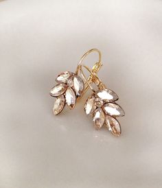 "Pretty pair of sparkling crystal leaf earrings featuring champagne crystals. From ear piercing: 1 1/4\" drop (long) x 1/2\" wide. Available in various metal finishes. Please make selection from the drop down menu at check out. Thanks for stopping by!" Mauve Earrings, Leaf Earrings Gold, Gold Wedding Earrings, Burgundy Earrings, Navy Blue Earrings, Champagne Earrings, Large Statement Earrings, Crystal Teardrop Earrings, Special Occasion Jewelry