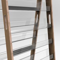 a wooden ladder with glass shelves on each side