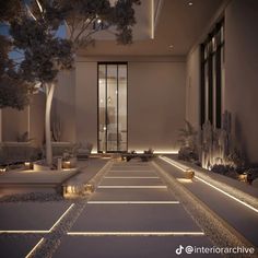 an outdoor area with lights and trees in the evening, lit up by lanterns on either side of the walkway