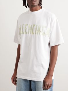 Balenciaga is constantly rehashing its logo, so its T-shirts always feel fresh. This one is made from soft cotton-jersey that's lightly distressed and cleverly printed with tape-inspired strips that spell out the brand's moniker for a DIY feel. White Balenciaga, Balenciaga Men, Latest T Shirt, White Shirts, T Shirt For Men, Oversized Tshirt, White T, Logo Print, Printed Cotton