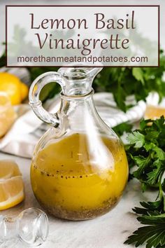 lemon basil vinaigrete in a glass bottle with parsley on the side