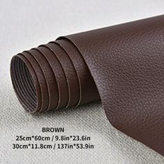 the brown leather has been rolled up on top of it and is ready to be used for