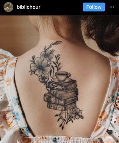 the back of a woman's neck with books and flowers on it