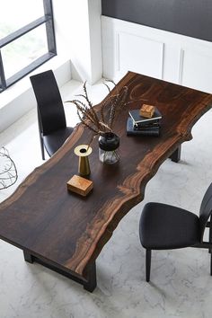 a large wooden table with chairs around it