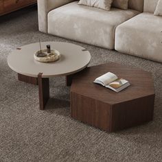 a living room scene with focus on the coffee table and two sofas in the background