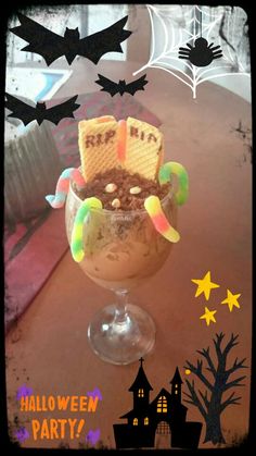 an ice cream sundae is decorated with halloween decorations