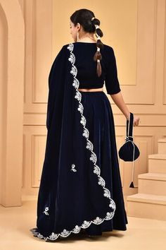 Midnight blue lehenga in velvet base. Paired with V neck padded blouse and gota lace embellished scallop bordered dupatta. Comes with a potli bag. - Aza Fashions Luxury Blue Dupatta With Cutdana, Formal Velvet Anarkali Sets, Festive Velvet Fitted Anarkali Set, Velvet Lehenga For Eid Reception, Fitted Traditional Velvet Sets, Fitted Velvet Sets For Reception, Velvet Sets With Dupatta For Reception, Fitted Velvet Lehenga With Resham Embroidery, Velvet Lehenga With Pallu For Eid