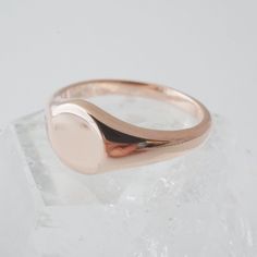 A miniature, sweet signet ring in a slim band with a flat, blank top. Our materials make for an amazing, high quality, seamless, jewelry piece with longevity. Our rings are plated with 18k gold, 18k rose gold, or sterling silver and finished with a protective coating. A little secret we’ll keep between us: it looks way more than it costs. Need help finding your ring size? See our printable ring size chart. Formal Rose Gold Stackable Rings Stamped 14k, Elegant Rose Gold Signet Ring With Polished Finish, Formal Rose Gold Rings With Smooth Bezel, Rose Gold Stackable Rings Tarnish Resistant, Sterling Silver Jewelry With Smooth Finish For Gifts, Classic Rose Gold Jewelry With Simple Design, Classic Rose Gold Jewelry Simple Design, Dainty Rose Gold Initial Ring With Tarnish Resistance, Dainty Rose Gold Initial Ring Tarnish Resistant