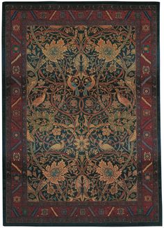 an intricately designed rug with birds and flowers on the center, surrounded by ornate designs