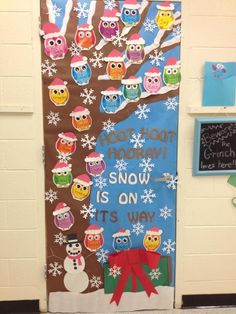 a door decorated with owls and snowflakes