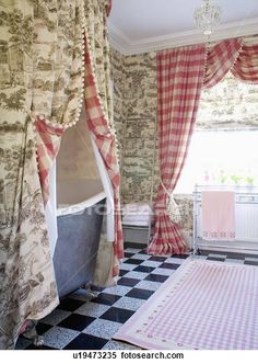 an old fashioned bathroom with checkered flooring and curtains