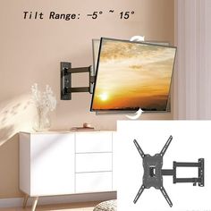 there is a tv mounted on the wall with it's arm pointing towards the screen