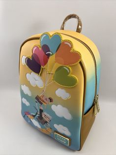 Description: Loungefly Disney Pixar Up Heart Balloons Mini Backpack New With Tags Show your love for adventure and carry around your necessities all in one stylish mini backpack from Loungefly! Featuring a graphic of Russell, Carl, Kevin, and Dug flying away on the die-cut heart balloon appliqués for a day full of fun, this Up-inspired bag is a great way to bring a touch of Disney•Pixar magic to your next Wilderness Explorer camping trip outfit. Also features an enamel brand badge, gold-toned hardware, adjustable shoulder straps, and an interior lining pattern of the movie's characters. Polyurethane; polyester lining Approx. 8 1/2" W x 11 1/2" H x 5" D Imported Condition: Factory New Cute Multicolor Backpack For Disney Trips, Themed Travel Backpack, Fun Travel Backpack With Zipper Closure, Fun Multicolor Backpack For Disney Trips, Playful Backpack For Disney Trips, Fun Multicolor Backpack For Travel, Disney Travel Backpack With Zipper Closure, Disney Multicolor Backpack For Everyday Use, Disney Multicolor Backpack For Daily Use