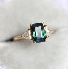 Bicolor Sapphire, Teal Sapphire Engagement Ring, Trillion Diamonds, Green Sapphire Ring, Triangle Diamond, Green Emerald Ring, Engagement Ring Ideas, Teal Sapphire, Buying An Engagement Ring