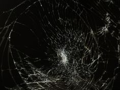 a cracked glass window in the dark