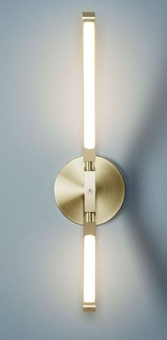 a light that is on the side of a wall with a white light in it