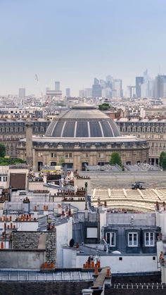 an aerial view of the city skyline with buildings in the background