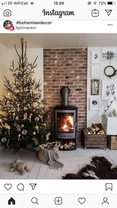 a living room with a christmas tree and fireplace